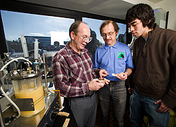 In laboratory, three scientists examine samples of new biobased glue. Link to photo information