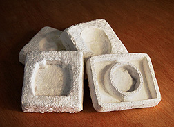Photo: Biodegradable packaging material made from a blend of cotton gin waste and fungi extruded to fit four different shapes. Link to photo information