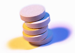 Photo: Stack of pink pills.